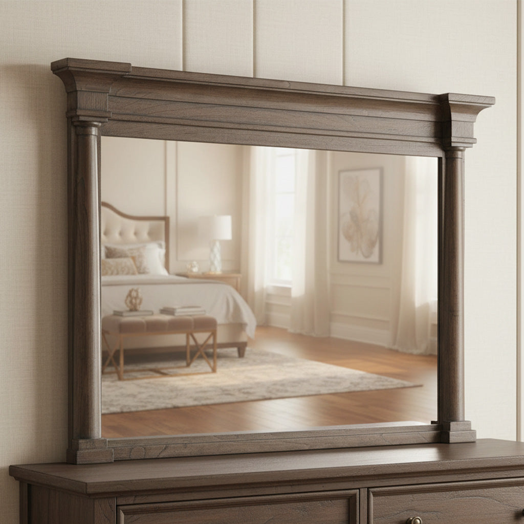 Beveled glass Lincoln Park mirror with dark wood frame featuring ornate top molding in bright bedroom setting