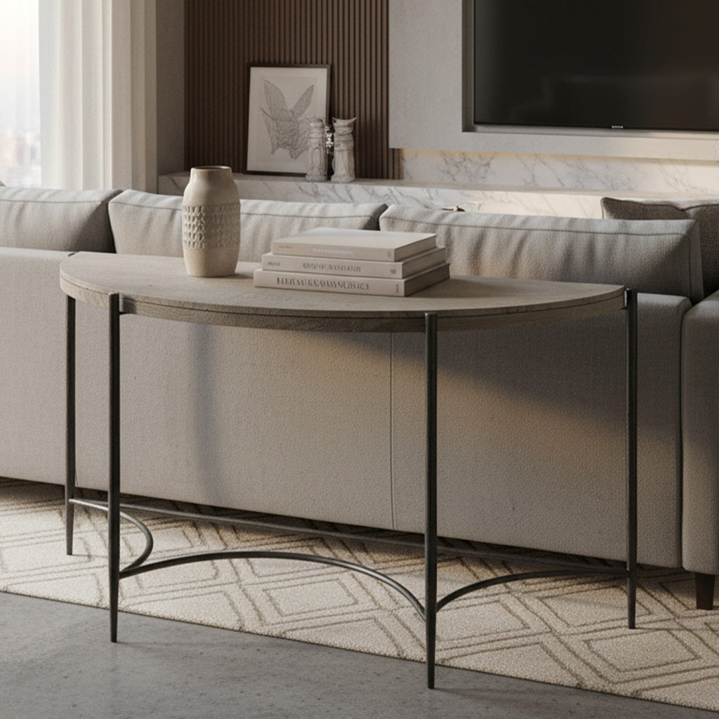 Half-moon sofa table with rough-hewn Bedford Park Gray wood top and wrought iron base behind light gray couch