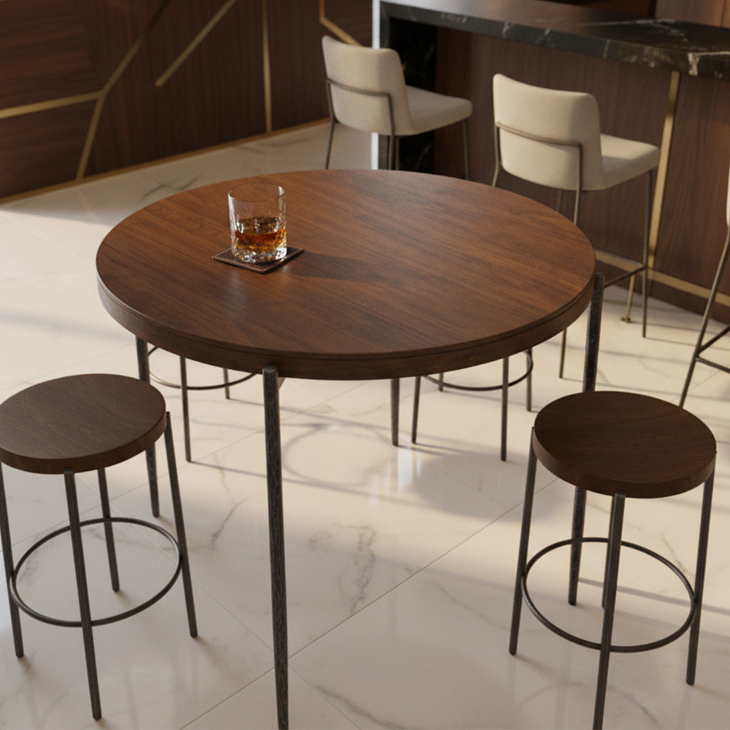 Round Bedford Park pub table with solid mango wood top and hand-forged iron base, two matching stools in modern space
