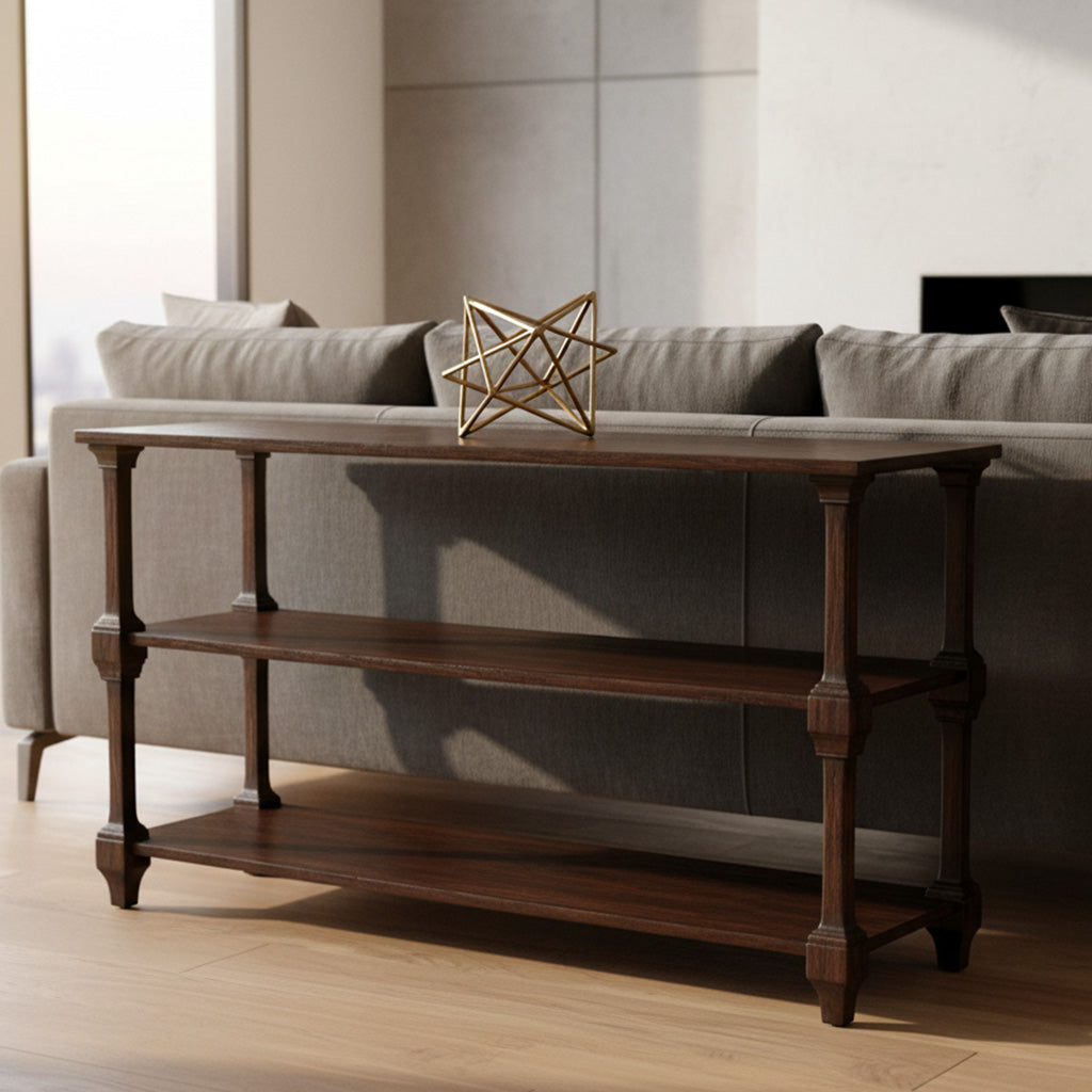 Dark wood console table with two shelves and decorative wooden legs in bright living room behind beige sofa