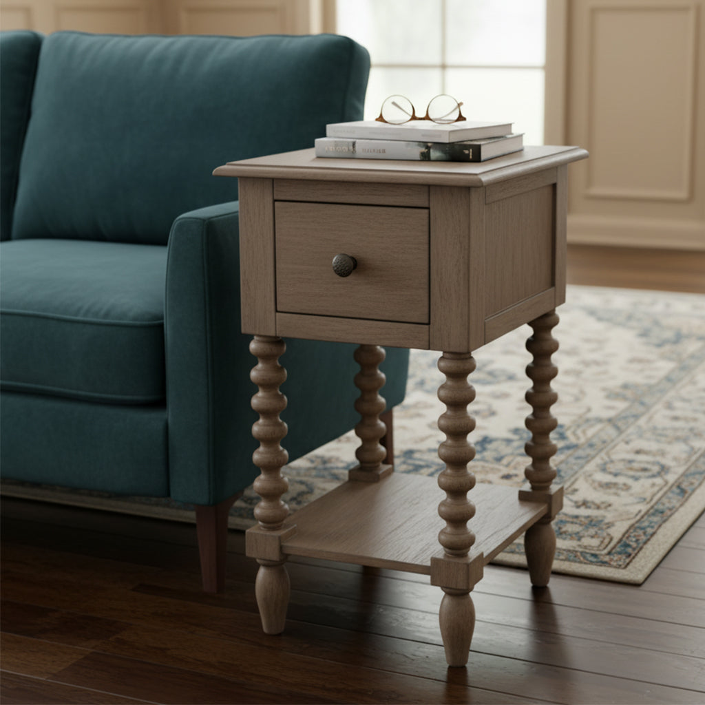 Single drawer end table with turned wood legs, lower shelf, and rustic wood finish next to teal upholstered sofa