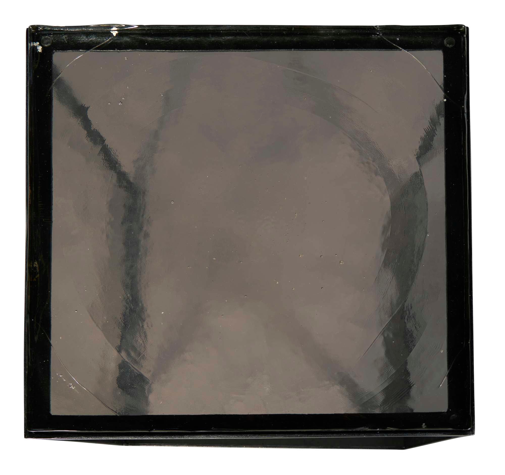 Square nesting table with hammered iron frame and round hand-poured glass top in modern design