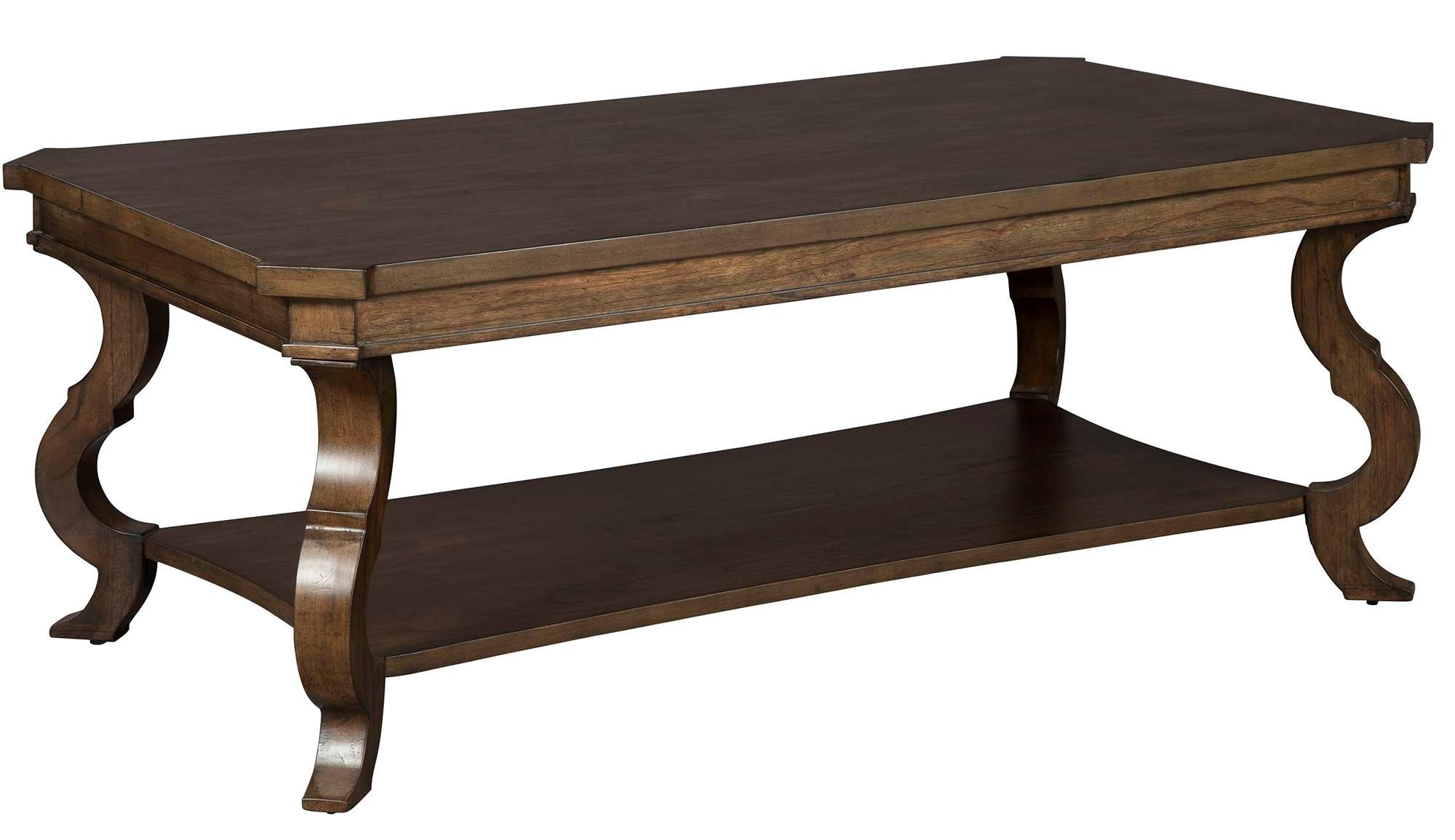 Rectangular coffee table in mindi wood with canted serpentine legs, lower shelf, and soft tawny brown finish