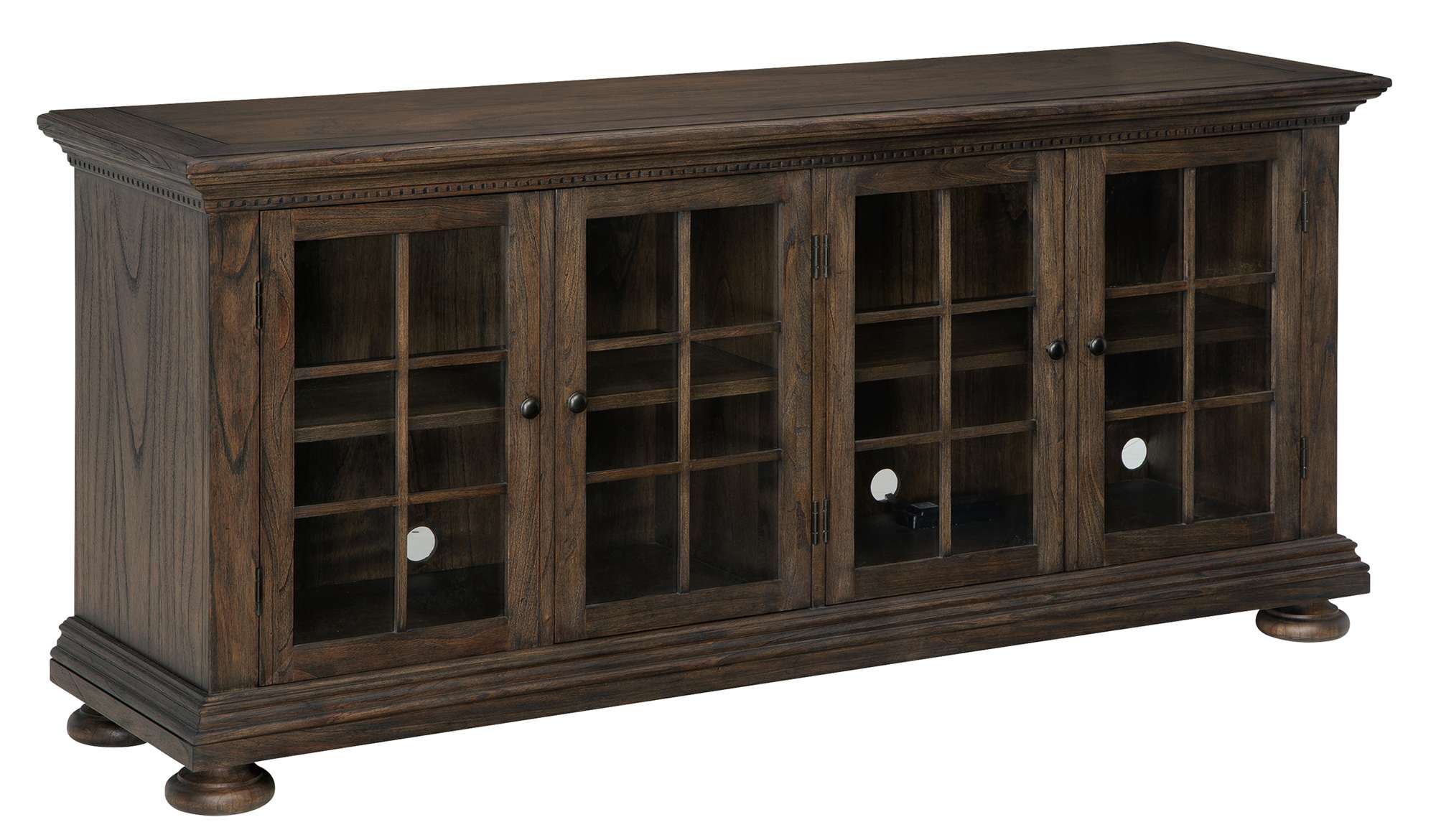 Wellington Estates entertainment console with mindi veneers, four glass doors with mullions, dentil molding, and antique brass hardware