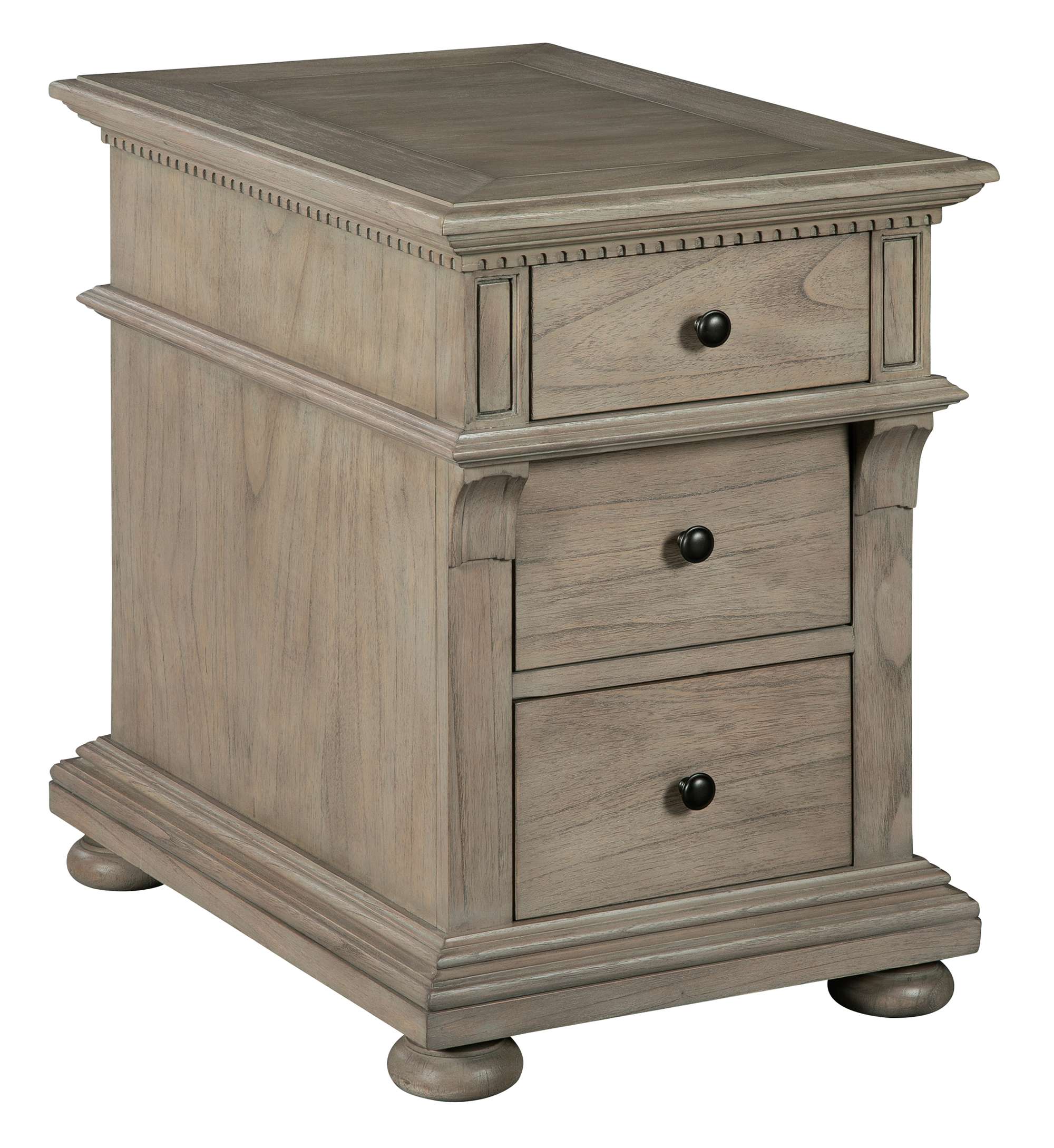 Wellington Estates chairside chest with driftwood finish, mindi veneers, three drawers, corbel support, dentil molding, and antique brass knobs