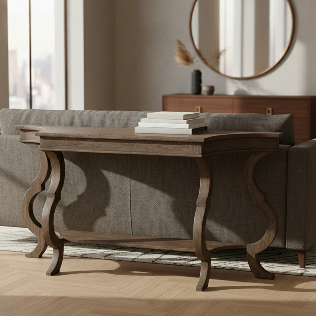 Lincoln Park sofa table in dark wood finish with curved legs and lower shelf behind gray upholstered sofa