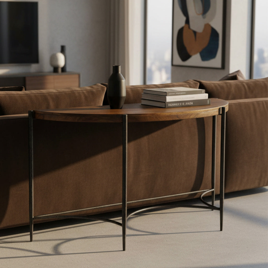 Bedford Park sofa table with rough-hewn wood top and wrought iron base behind brown upholstered sofa in modern living room