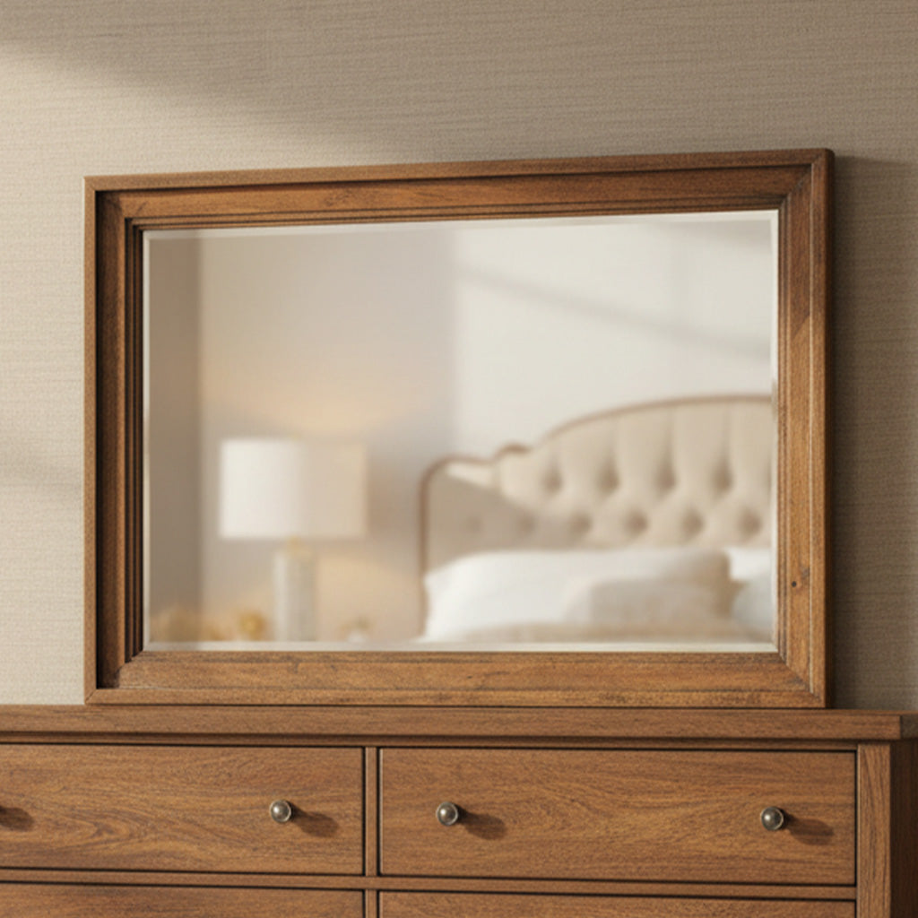Rectangular beveled glass mirror with solid mango wood Bedford finish frame above matching wooden dresser