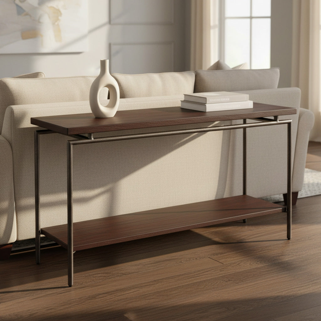 Rectangular sofa table with solid mango wood top, iron tubular legs, and lower shelf in sunlit modern living room