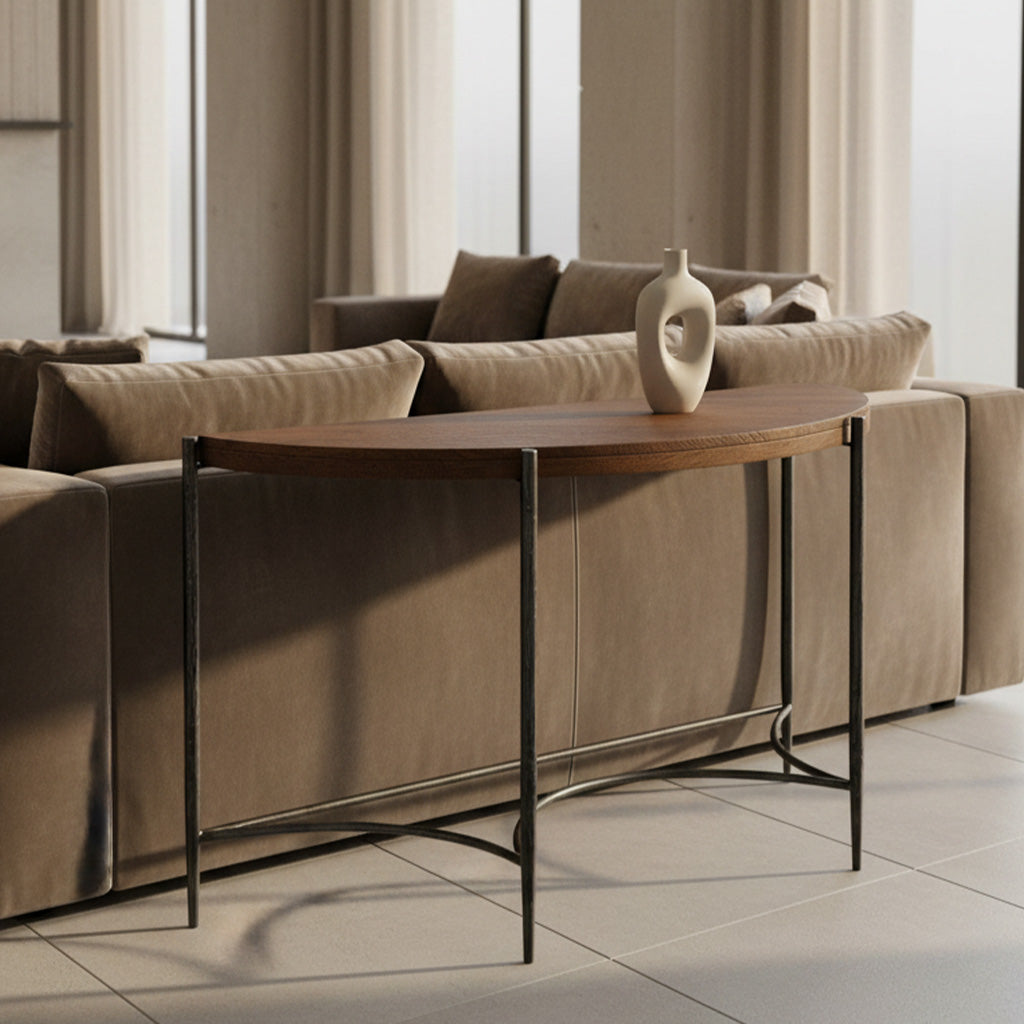 Sleek Bedford Park sofa table with rough-hewn wood top and wrought iron base behind beige sectional sofa in bright room
