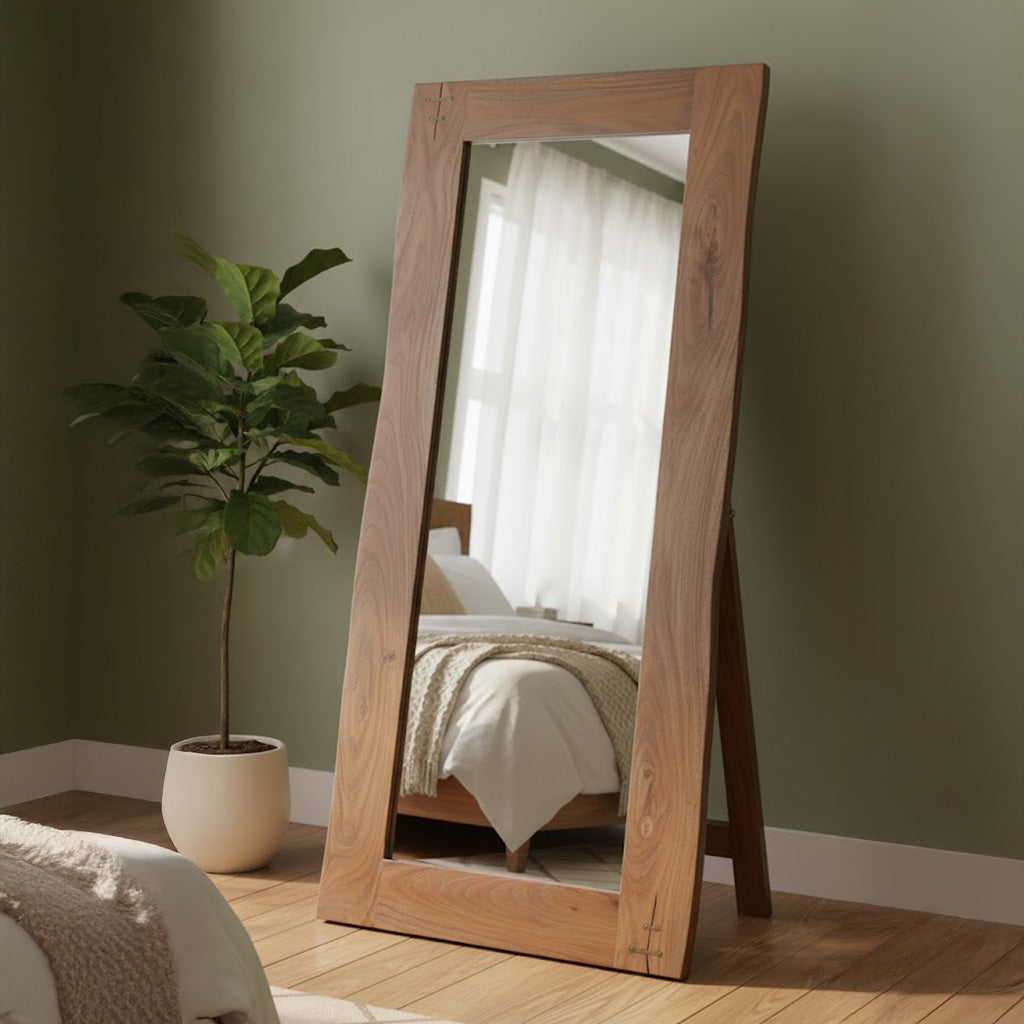 Full-length floor mirror with live edge solid acacia wood frame and hinged stand in cozy bedroom setting